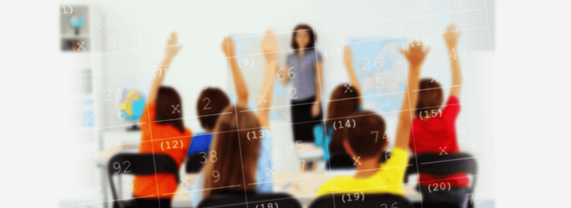 Image showing a classroom of students with their hand raised and a female teacher in front of a whiteboard.